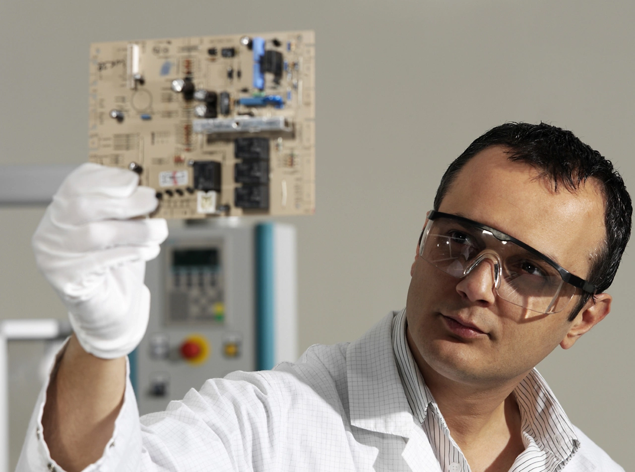 Man inspecting circuit board (purchased)