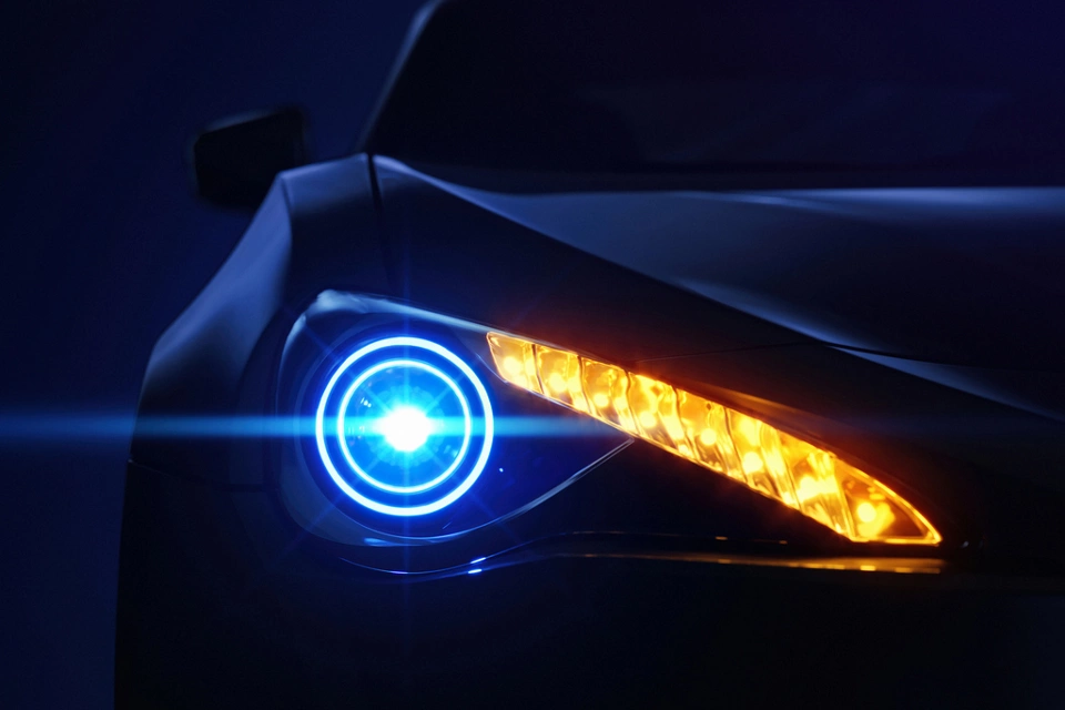 Car headlight with copy space macro view. Led or xenon lamp. Closeup of modern prestigious car. 3d illustration.